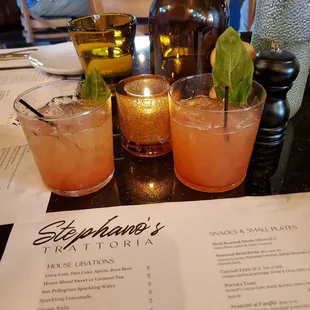 three cocktails on a table