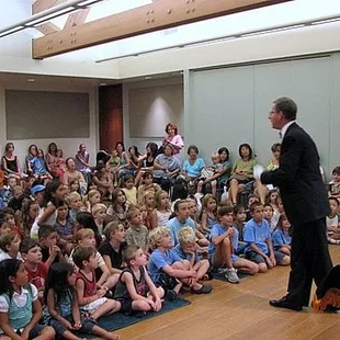 Library show with captivated children and their parents in 2013