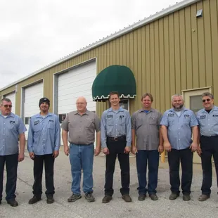 Mechanics in front of Mechanical Shop