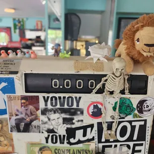 a stuffed lion on top of a refrigerator