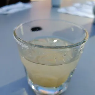 a glass of lemonade on a table