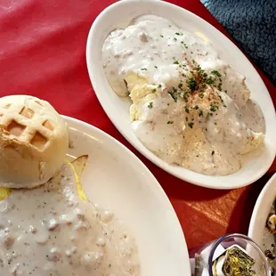 Smothered bad ass omelet with gravy on top and a order of the biscuits and gravy with a side of fried eggs