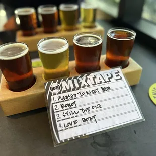 a flight of beers on a table