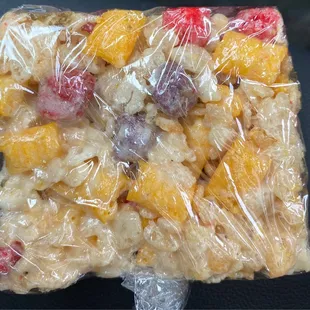 a square of food wrapped in plastic