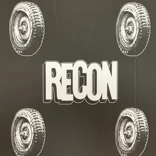 a black and white image of a tire with the word region on it