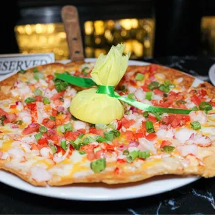 a pizza with a pineapple on top