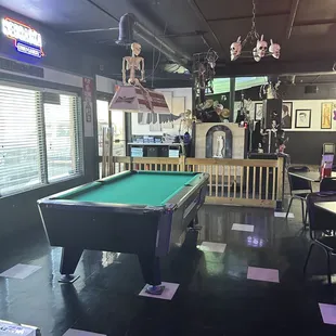 a pool table in the middle of the room