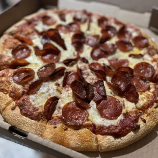 a pepperoni pizza in a box