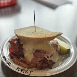 Pastrami and Swiss w / mustard on toasted rye.