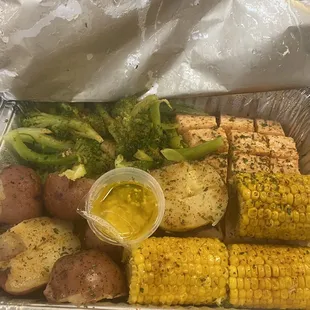 Broccoli, salmon, corn , and potato