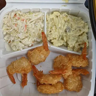 Coconut shrimp platter (minus one I ate before the picture) with coleslaw and potato salad