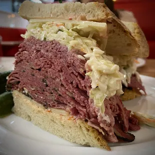 a corned beef sandwich with pickles