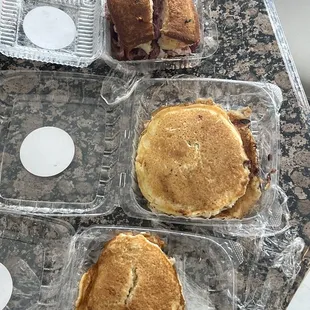 three pancakes in plastic containers
