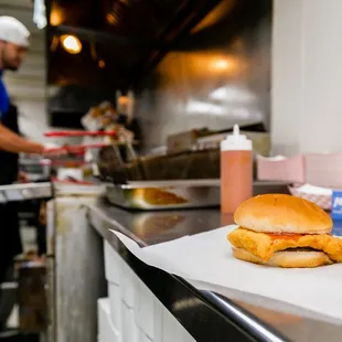 a man preparing a sandwich