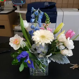 Mixed spring flowers (in pink/blue/white upon request) in glass cube