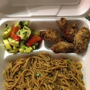 Lemon pepper chicken with garlic noodles and steamed zucchini and yellow squash medley