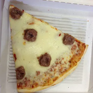 Pizza by the slice during "power lunch". As of this writing, they only offer cheese, sausage and pepperoni.