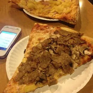 Huge Slice of Sausage Mushroom Pizza