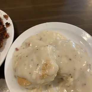 The biscuits and gravy were delicious with bits of ham in it.
