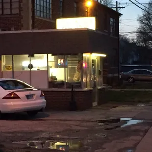 a car parked in front of a restaurant