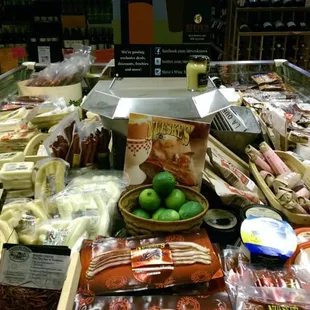 a display of cheese, olives, and other foods