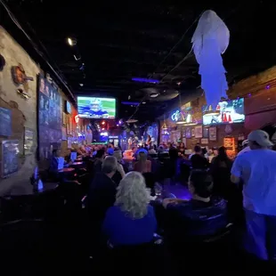a crowd of people at a bar