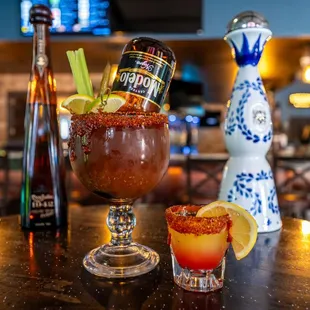 a bloody drink and a bottle of booze
