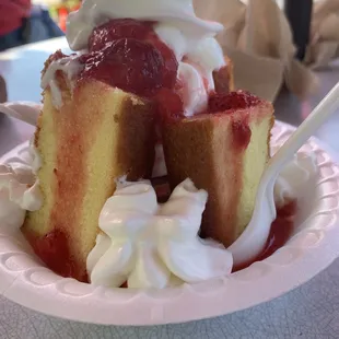 a strawberry shortcake with whipped cream