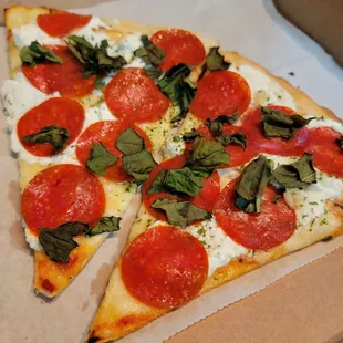 White Pizza with Pepperoni and Basil.