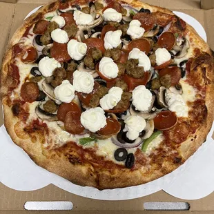 Combination pizza topped with ricotta