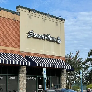 a car parked in front of a restaurant