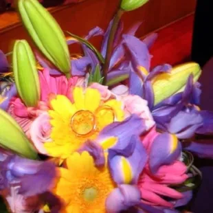 Our wedding rings on my bouquet.