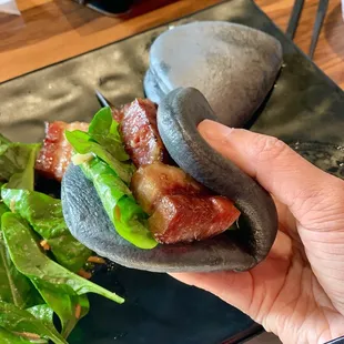 Pork belly on charcoal bao