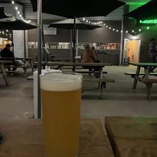 a pint of beer on a table