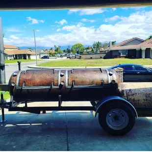 a stick fire bbq on a trailer