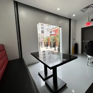 a room with a table and chairs