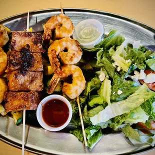 Shrimp and Tofu with salad and mixed vegetables.