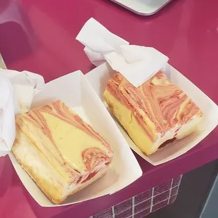 two trays of food on a table