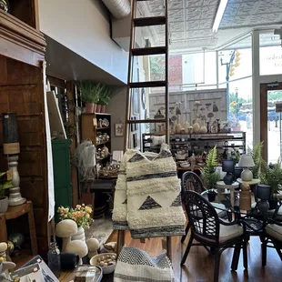 Keeping the old rolling ladders adds a nostalgic touch. I can almost picture the old hardware store