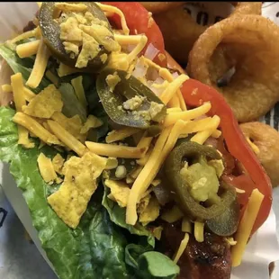 a hot dog with cheese and jalapenos