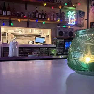 The bar atmosphere, which includes a wide collection of dvds that they cycle on a vintage tv.