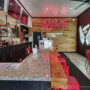 a bar with neon signs