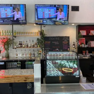 two televisions above the counter