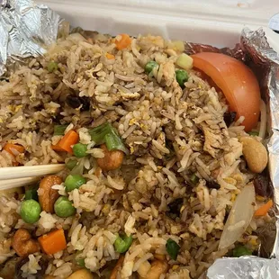 chopsticks in a takeout container