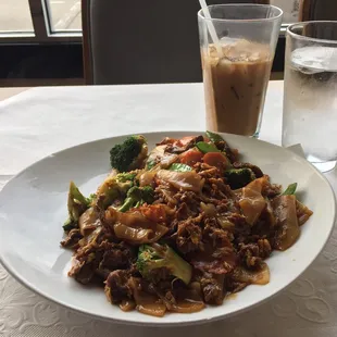 a plate of food and a glass of water