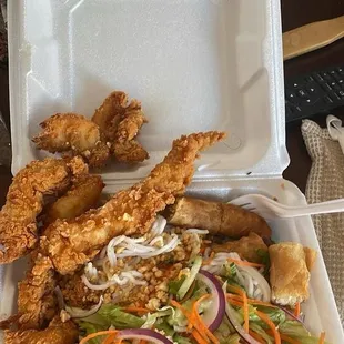 Salad with rice noodles, chicken tenders, and spring roll