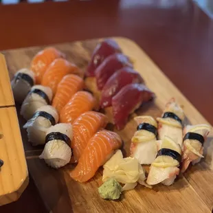 a chopping board with sushi on it