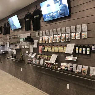 Products on an open wall display, broken up into categories for ease!  Browse your options, while you speak to their knowledgeable staff!