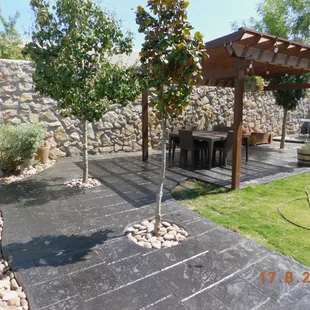 a patio with a table and chairs