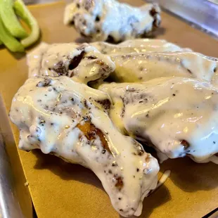 Smoked oak chicken wings in Alabama white sauce.